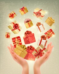 Christmas gold background with gift boxes and hands. Vector illu