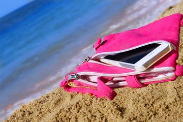 Smartphone in the Woman Purse on the Beach