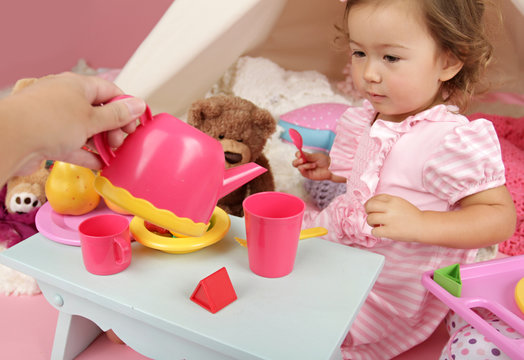 Parent Or Friend Playing With Kids At Home: Toddler Tea Party