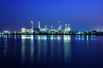 Oil refinery industrial plant at night