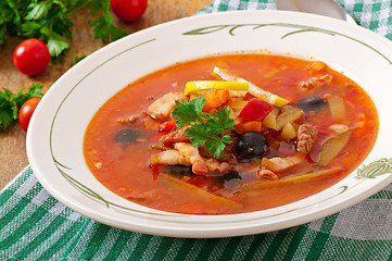 Soup solyanka Russian with meat, olives and gherkins