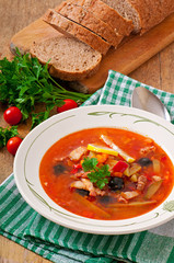 Soup solyanka Russian with meat, olives and gherkins