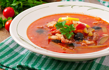 Soup solyanka Russian with meat, olives and gherkins