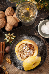 Baked apple with nuts, honey and oat flakes