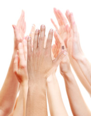 Group of young people's hands isolated on white