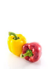 Red and yellow peppers solated on white