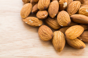Almond on wooden background