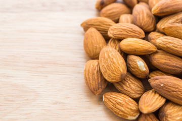 Almond on wooden background