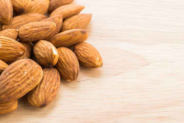 Almond on wooden background