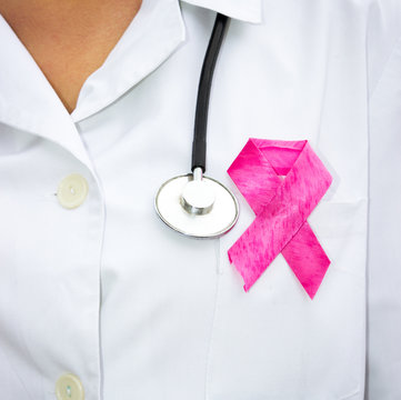 doctor with  a pink symbol of AIDS
