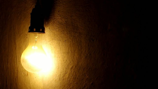 old light bulb light and darkness