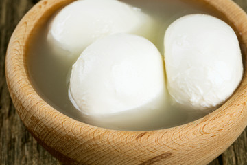 mozzarella cheese on wooden table