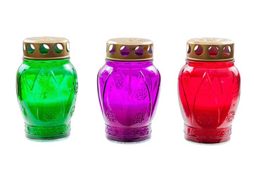 Colored votive candles on white background