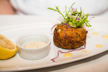 Crab Cake with Sauce and Lemon