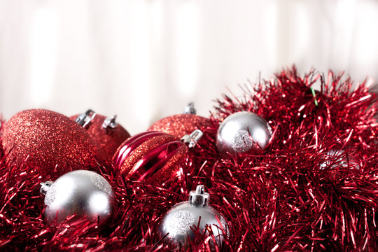 Red Christmas Decoration in Foreground Overexposed Background