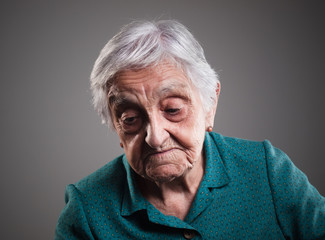 Sad elderly woman