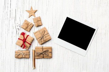 Polaroid and Christmas tree made of wooden branches