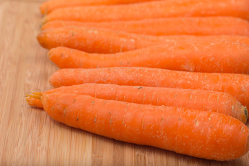 Fresh carrot on a wooden table
