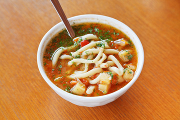 laghman soup in white bowl