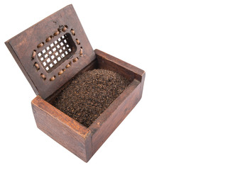 Dried, processed and blended tea leaves in wooden box