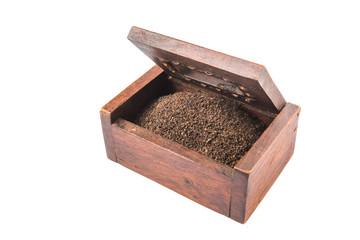 Dried, processed and blended tea leaves in wooden box
