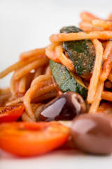 Italian spaghetti with olives and tomato