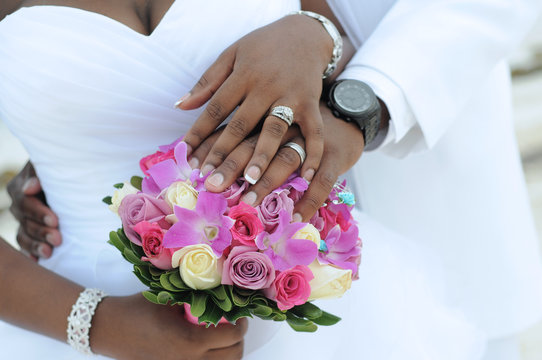 Black couple, hands and flowers