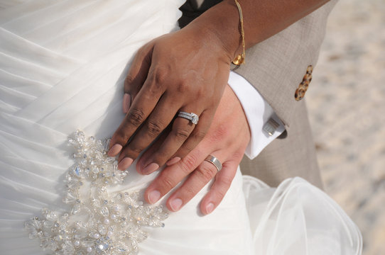 Interracial wedding couple and hands