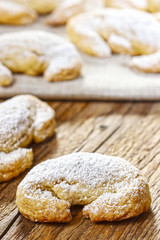 Delicious croissants on wooden table
