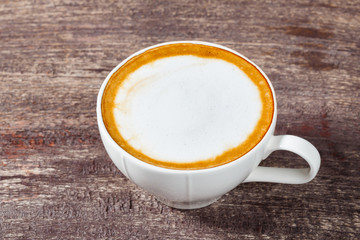 Coffee cup on old wooden table