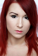 Beautiful redhead young woman with bright make up portrait