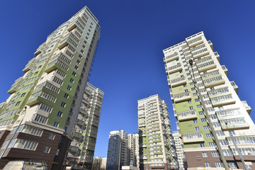Naklejka premium High residential buildings on the background of blue sky