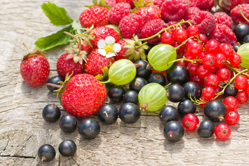 Naklejka na ściany i meble Berries on wooden background