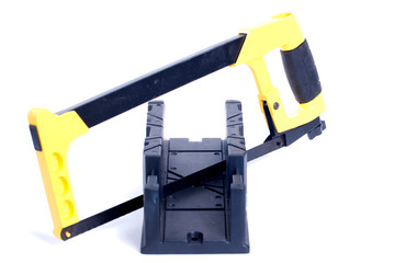 Fototapeta premium Saw and bracket for ceiling moldings on a white isolated backgro