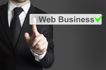 businessman pushing flat touchscreen button web business green c