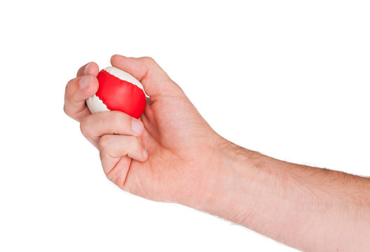 Male hand with a red and white ball