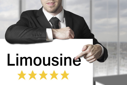 businessman pointing on sign limousine five stars