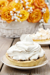 Pavlova cake filled with peach jam,