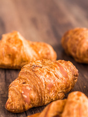 croissant with chocolate on a wooden board, french kitchen