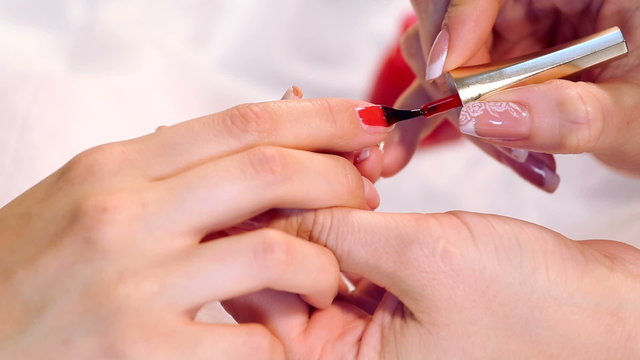 Spa manicure procedure.Paint nails in the salon.