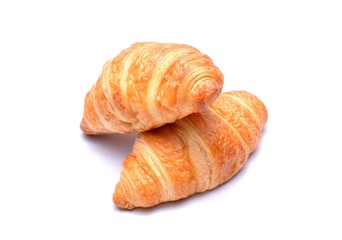 Fresh and tasty croissants isolated on white background