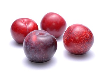 plums isolated on white background