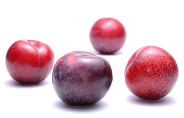 plums isolated on white background