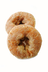 Two Spicy Glazed Pumpkin Donuts on White