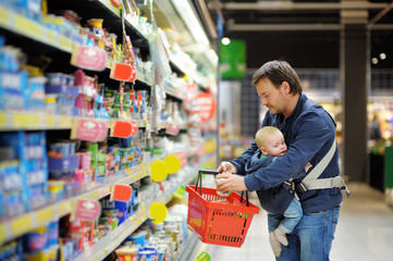 Father and his son at supermarket