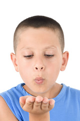 Adorable child sending a kiss a over white background