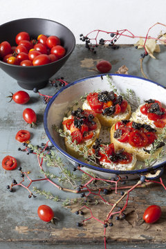 mediterranean bruschetta with cherry tomatoes, olive and thyme