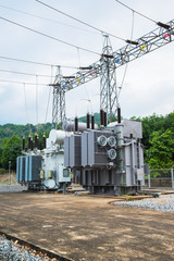 Fototapeta na wymiar Transformer station and the high voltage electric pole