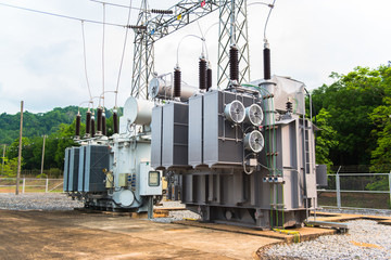 Fototapeta na wymiar Transformer station and the high voltage electric pole