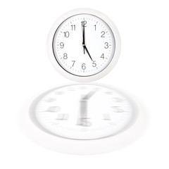 White clock face showing five o'clock